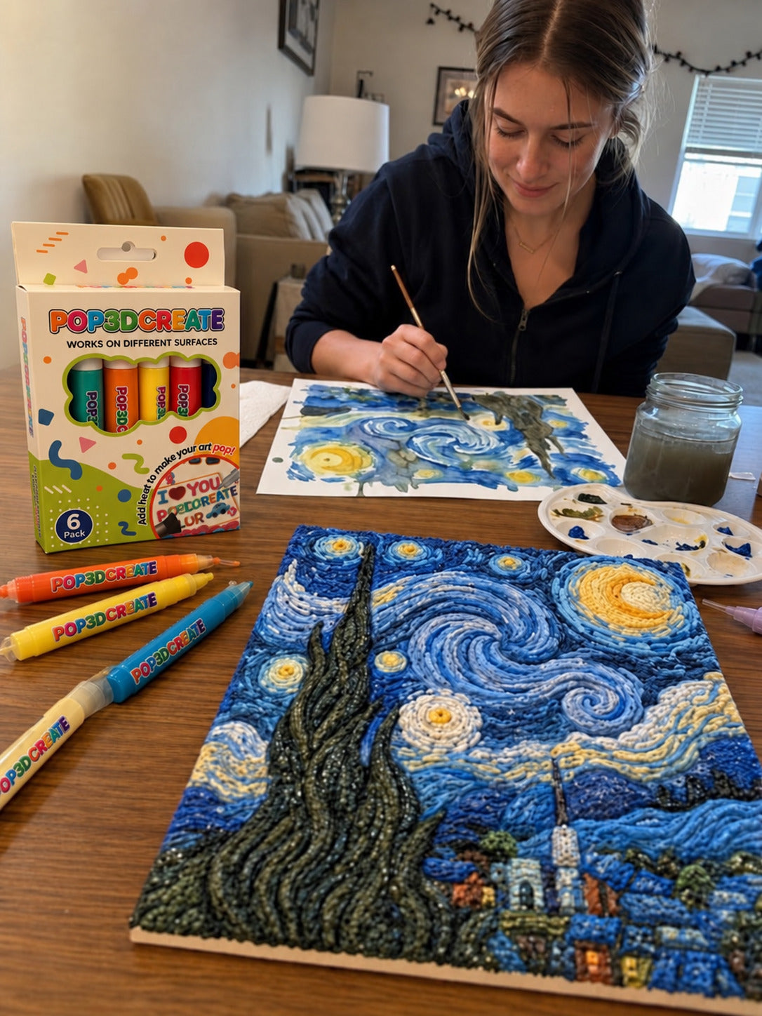 Customer creating a raised Starry Night painting at a table.